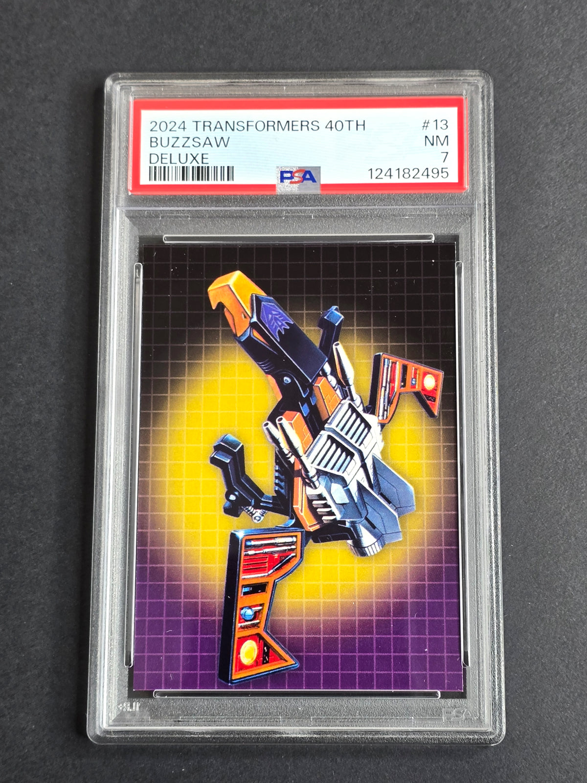 2024 Dynamite Transformers 40th Anniversary Buzzsaw #13 Deluxe Card Graded PSA 7 NM